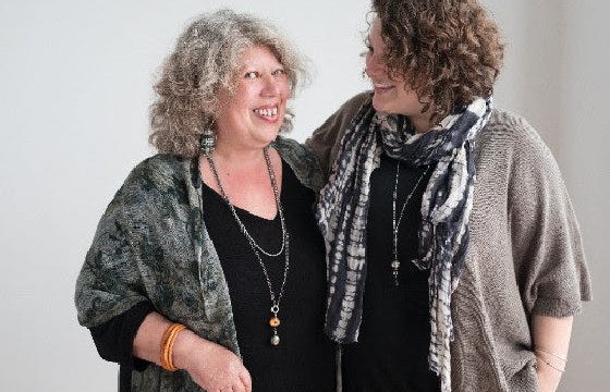 The founder of Bead Paradise with a friend, celebrating over three decades in business